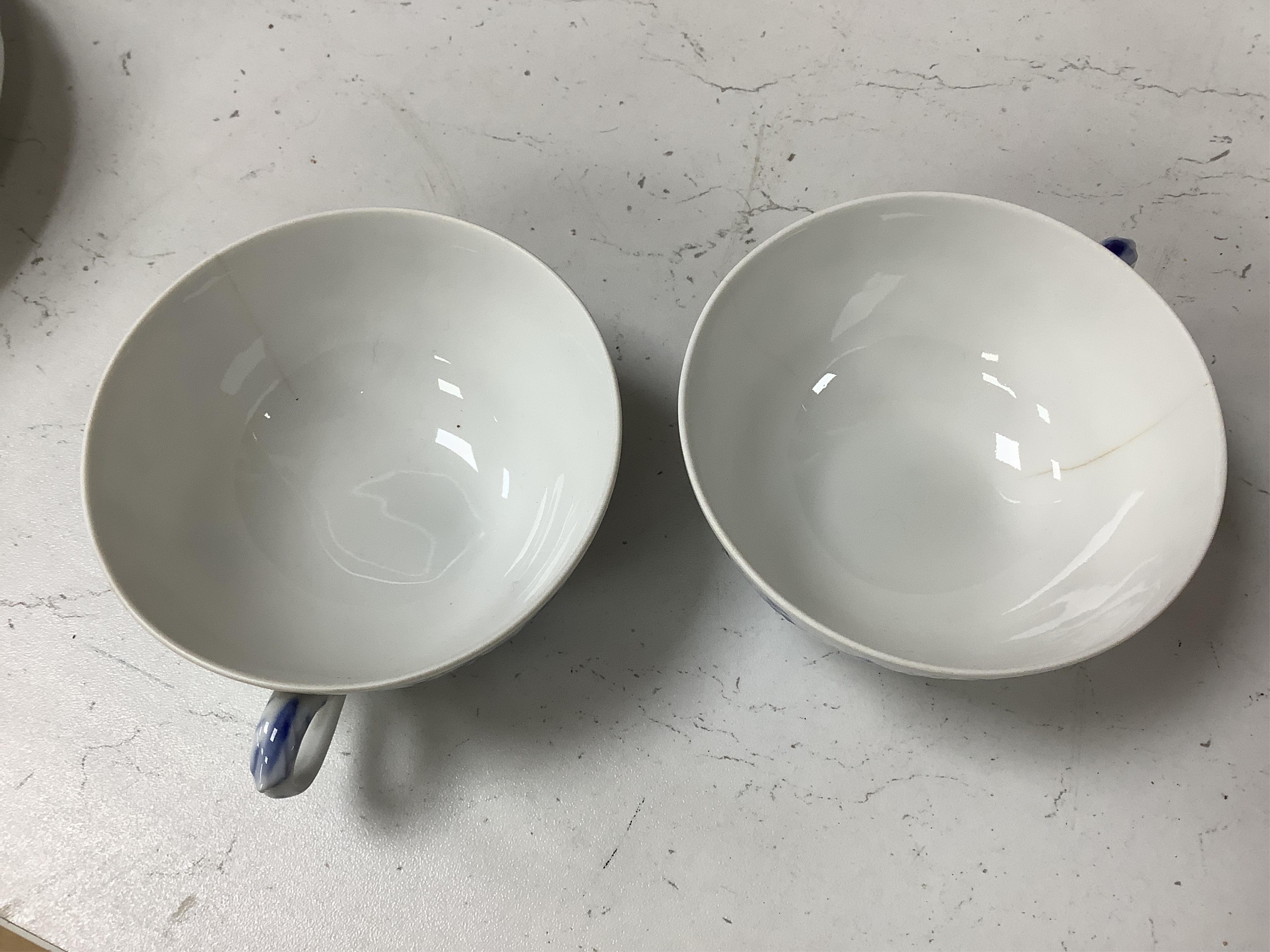 A collection of Royal Copenhagen and Bing & Grondahl onion pattern blue and white tableware